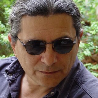 Κώστας Καρυστινός – Συνθέτης – Στιχουργός – Ερμηνευτής
